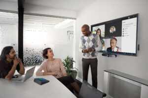 Team collaboration in modern meeting room using Dell display and devices